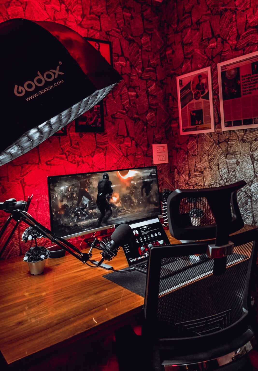 Twitch streamer Kathelina breaks silence after Imnotkenneth cheating claims as viral litter box camera controversy grows A stylish gaming desk with a monitor and accessories, illuminated by red lighting in a cozy room.