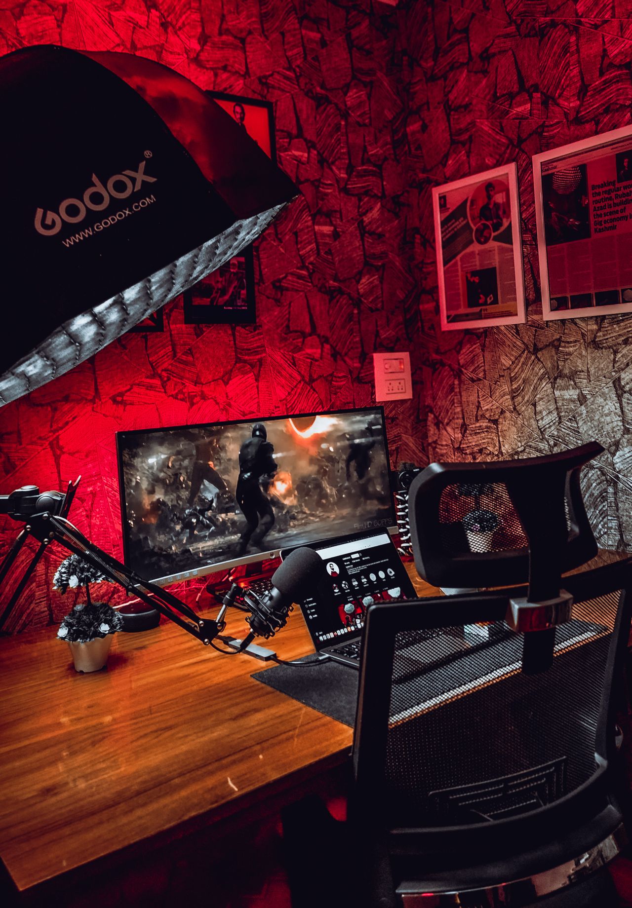 Twitch streamer Kathelina breaks silence after Imnotkenneth cheating claims as viral litter box camera controversy grows 1 A stylish gaming desk with a monitor and accessories, illuminated by red lighting in a cozy room.