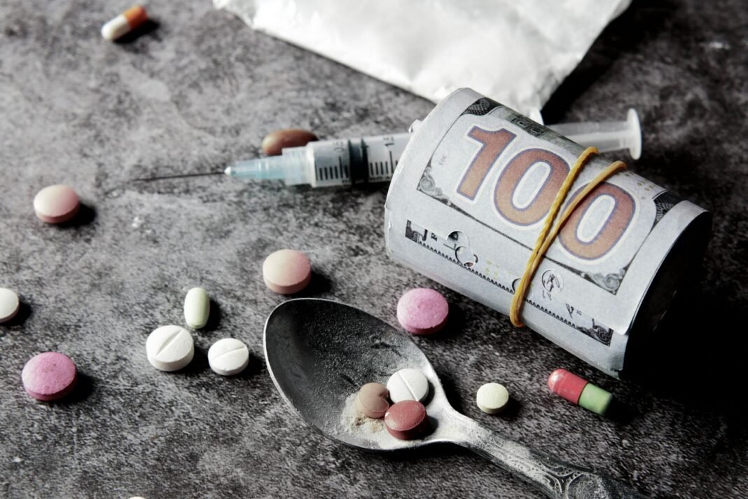Congress shares video of Sangrur man consuming poison outside Punjab DC office Symbolic representation of drug addiction and financial cost with pills and money.