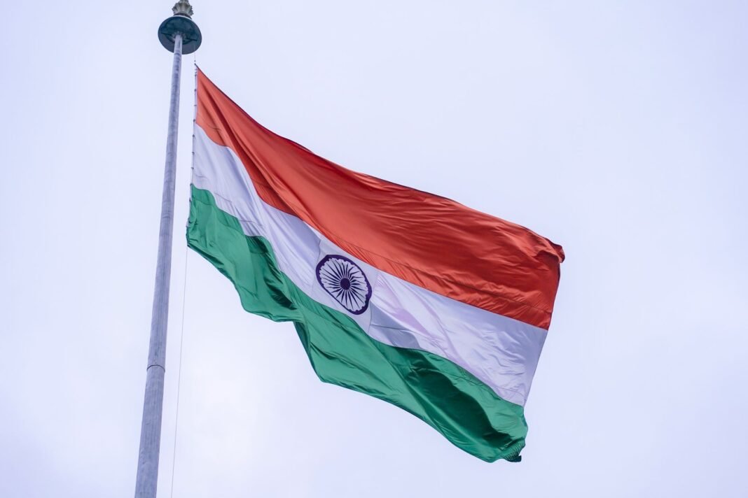 BJP MLAs recite full Vande Mataram after official recording stops at two stanzas The Indian national flag proudly waves on a flagpole against a clear blue sky in Noida, India.