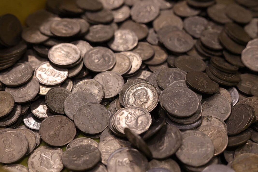 BJP’s Sudhanshu Trivedi accuses Congress of shift to “ultra-Left” after Hamid Ansari’s Nehru remarks Collection of vintage Indian coins with various historical figures and details.