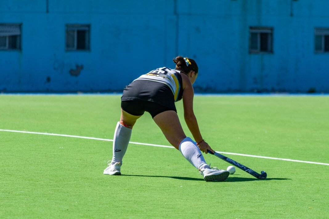 India women’s hockey rout Indonesia 17-1 at Asian Games 2026, back up 19-goal opener with second straight blowout A dynamic moment captured of a female field hockey player in action during a match on a sunny day.