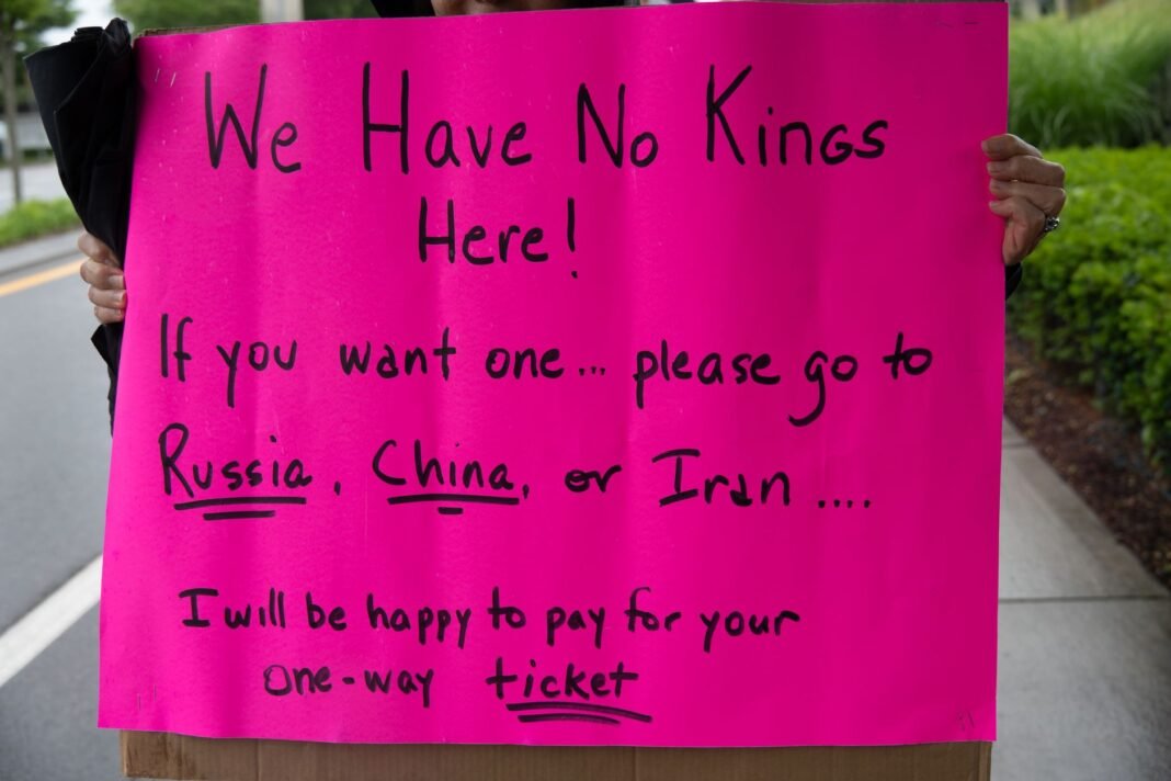 Iran’s military dismisses Trump’s “annihilate” threat as sign of US “strategic desperation” A vibrant protest sign in South Kingstown, Rhode Island, advocating against monarchies with political messaging.