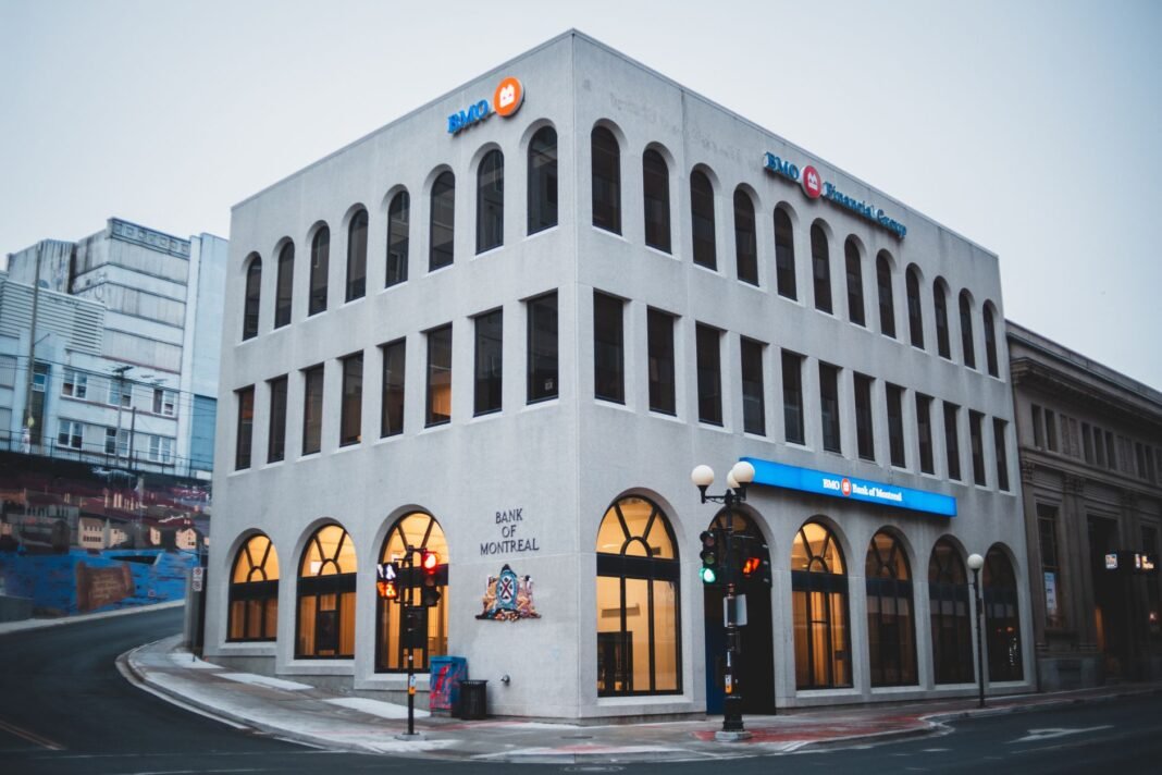 Bank strike set for September 28-30 leaves Quebec customers facing uncertainty over branch closures Exterior of contemporary building of bank with arched passages near asphalt road in evening